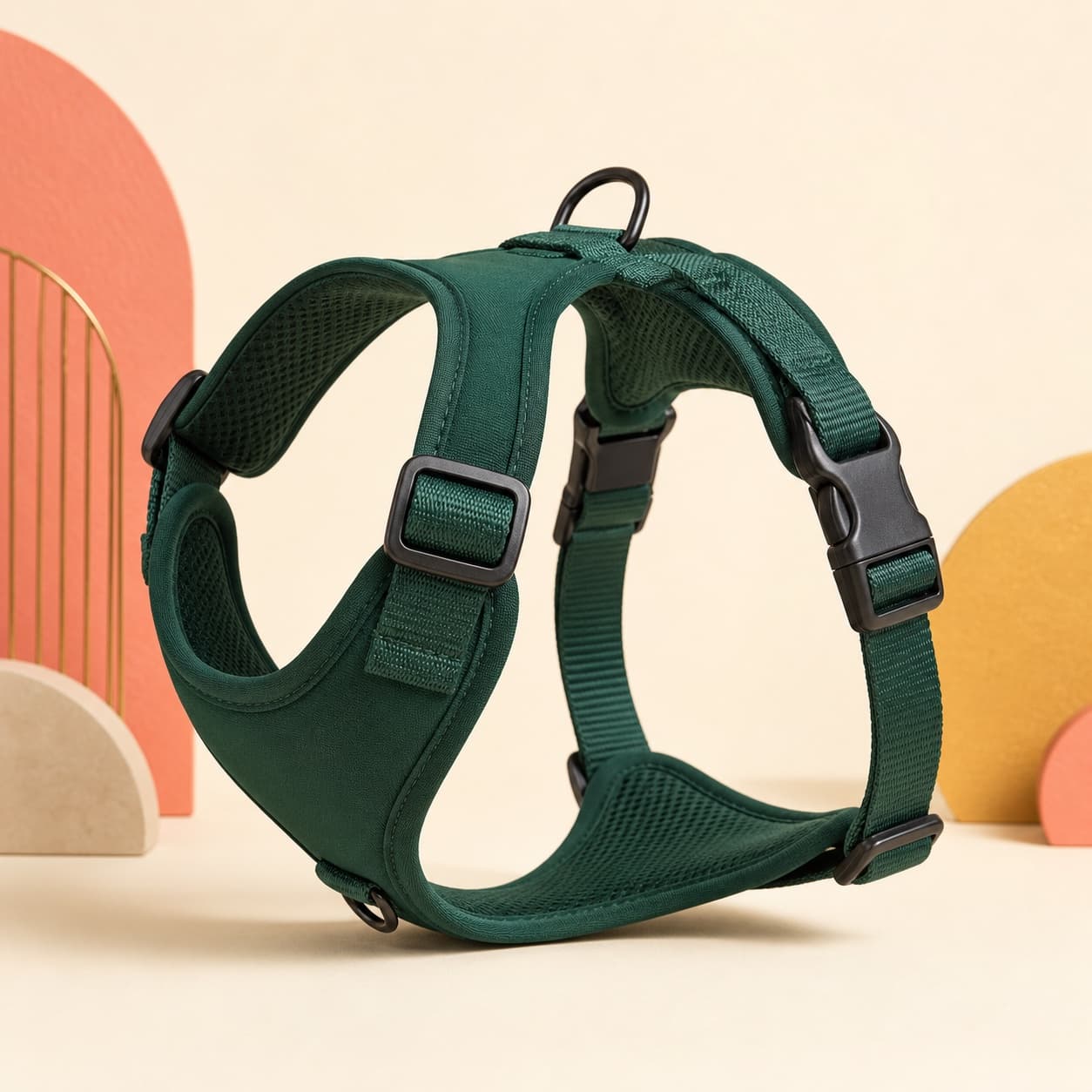 Forest green Trail-Ready dog harness on a warm cream studio backdrop.
